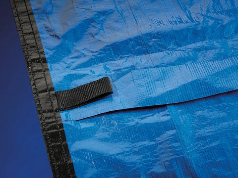 Close-up of Yard Guard above-ground winter pool cover reinforced edge and nylon loop
