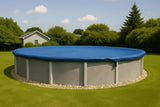 Yard Guard blue winter cover installed on a round above-ground pool